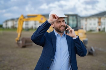 Construction Foreman On Phone Productively Working
